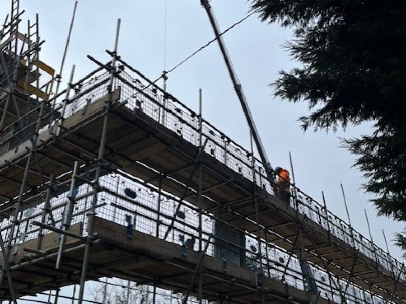 Crane on site lifting Timber Frame sections 24.02.26